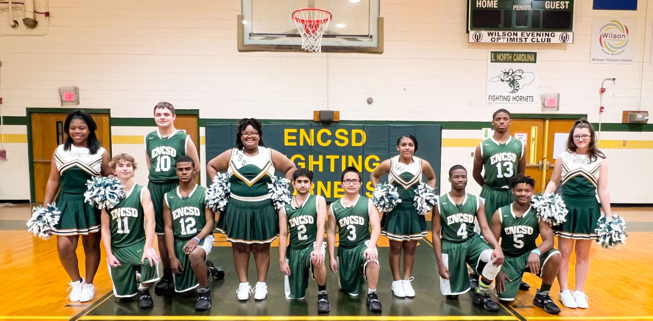 ENCSD boys basketball team and cheerleader squad.