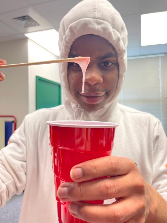 Student extracting DNA from strawberries.
