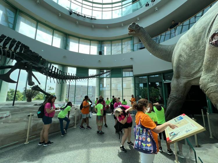 Students at the NC Museum of Natural Sciences with dinosaur exhibits