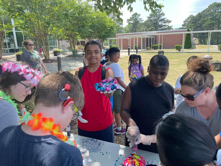 Students tie-dying t-shirts