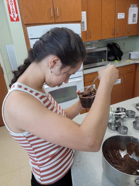 student making a dessert cup