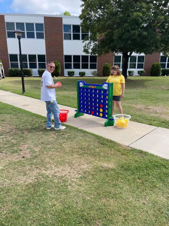 Staff playing giant connect-four