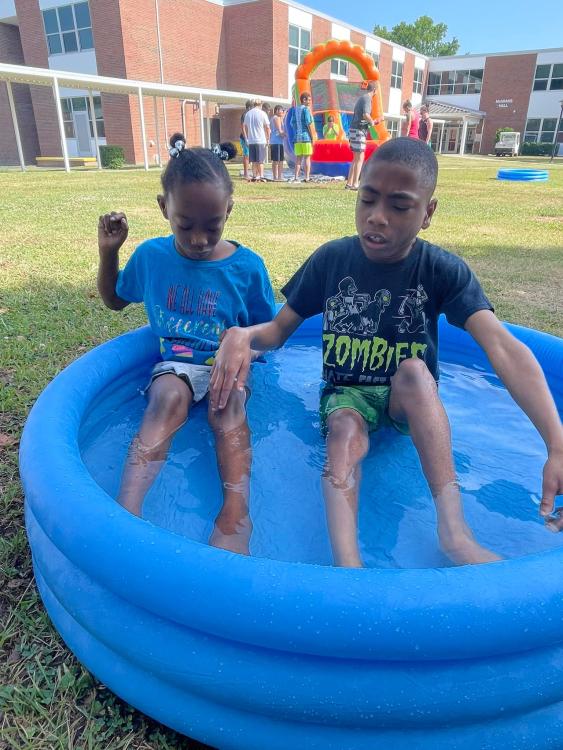 Students playing in wading pool