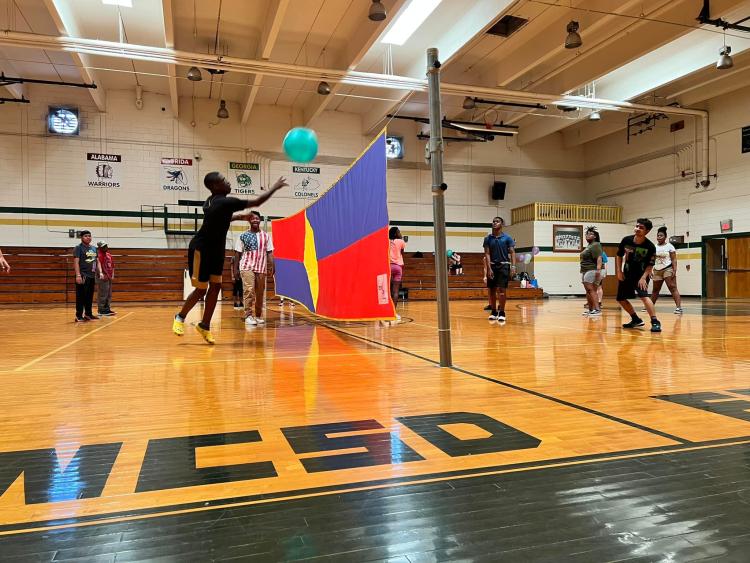 students playing blind volleyball