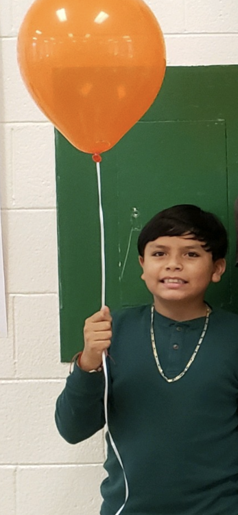 Student with an orange balloon.