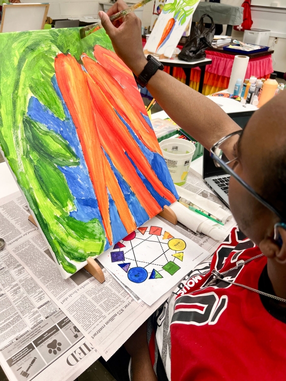 students painting carrots