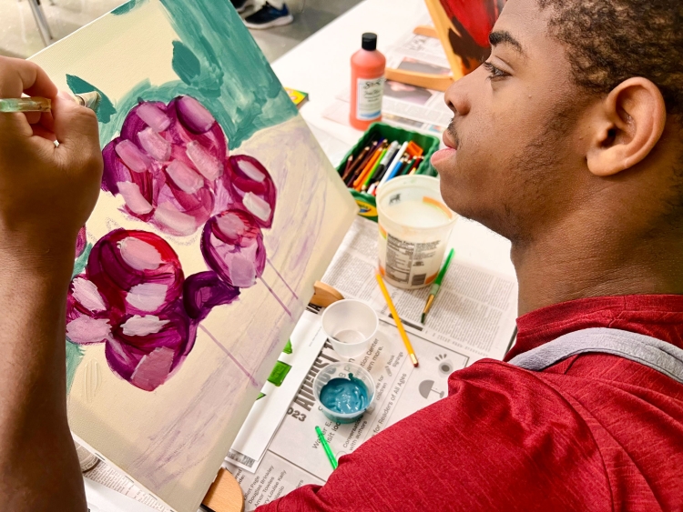 Student paints grapes