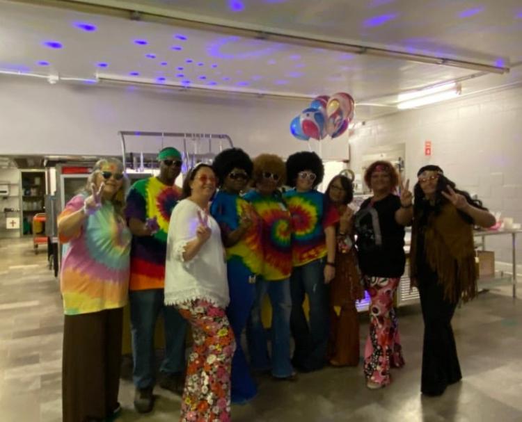 School staff dressed in 60s and 70s outfits