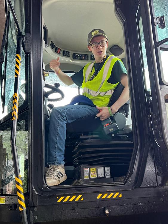 Student in a Caterpillar wheel dozer