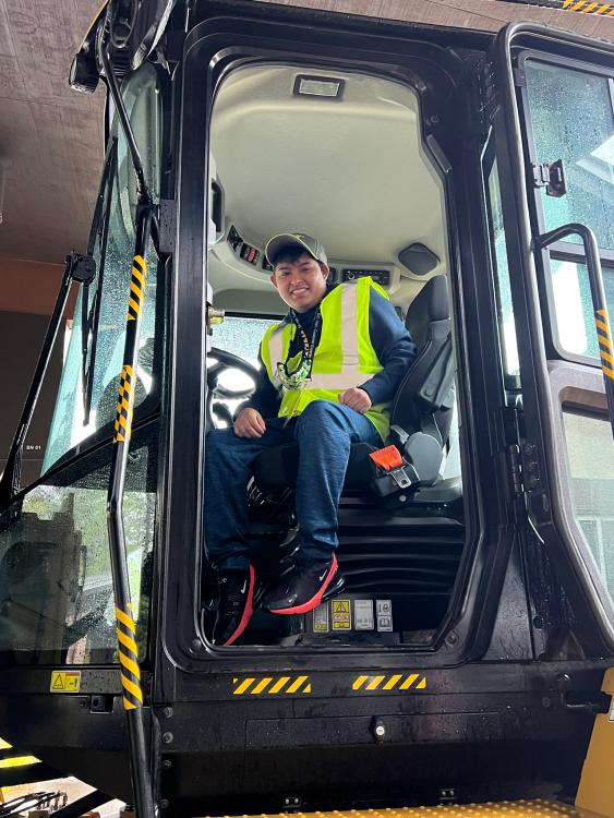 Student in a Caterpillar wheel dozer