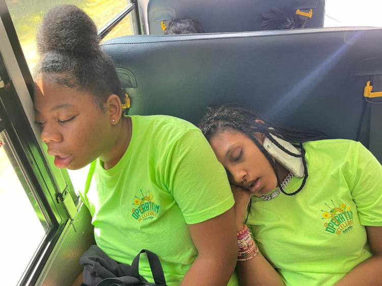 Students asleep on the school bus