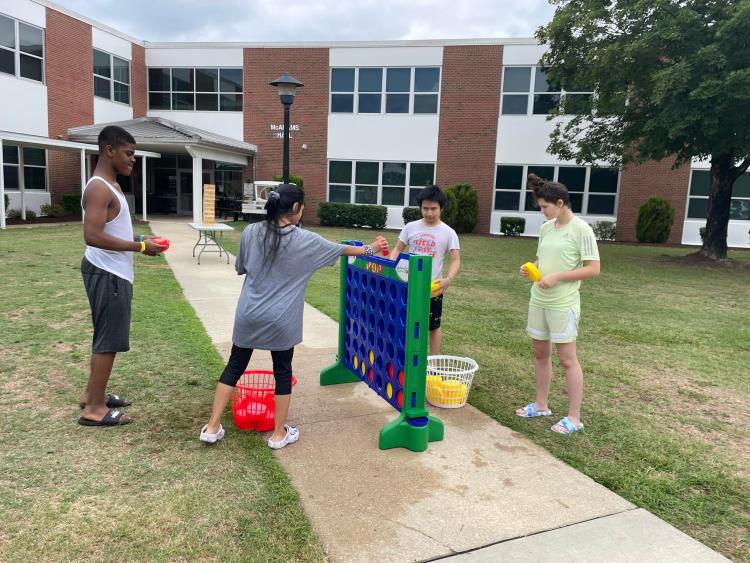 students playing giant connect-four