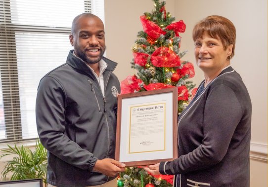 ENCSD receives congressional record from representative of Congressman Don Davis's office