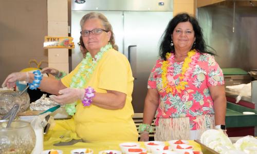 Gisele and Tricia serving up Hawaiian Day
